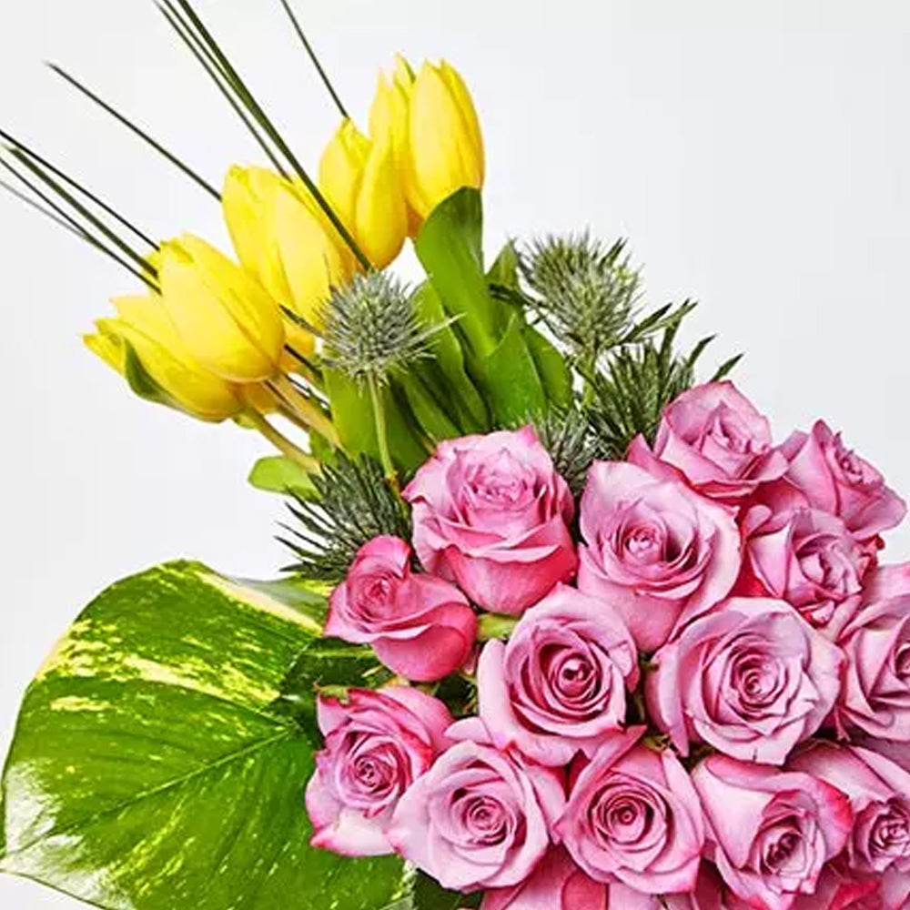 Ramadan - 12 Yellow Tulips 20 Purple Rose 3 Eryngium 1 Photo Leaf 5 Steel Grass 1 Green Vase Height : 25 cms