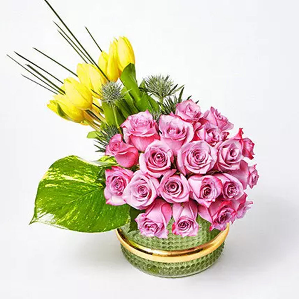 Ramadan - 12 Yellow Tulips 20 Purple Rose 3 Eryngium 1 Photo Leaf 5 Steel Grass 1 Green Vase Height : 25 cms